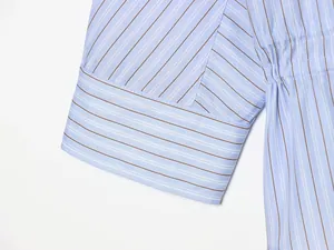 Close-up of striped cuff showing fabric texture and neat stitching of the shirt