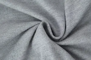 Detailed macro view of the grey knitted fabric texture for women's slim apparel