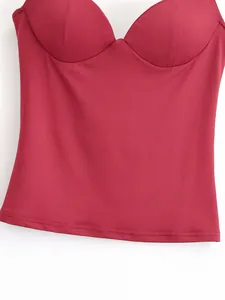 Detailed close-up of a dark red corset style top featuring molded cups and smooth fabric
