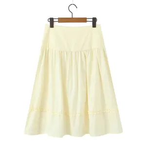 Elegant pale yellow A-line midi skirt featuring tiered ruffle details and delicate hem frills.
