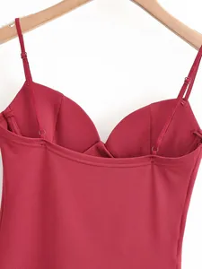 Detailed view of burgundy shaping camisole top with slim straps and fine fabric texture