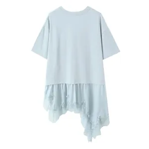 Light blue oversized T-shirt featuring an asymmetrical lace hem and ruffled hem detail