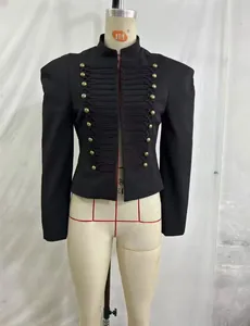 Detailed view of an elegant black military blazer with gold buttons and shoulder pads