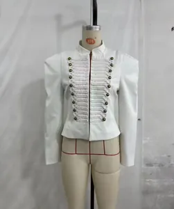 Detailed view of white military-style slim blazer with gold buttons and shoulder pads