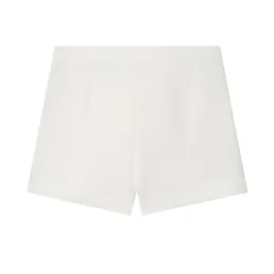 Detailed back view of minimalist high-waisted white asymmetric fashion skort shorts
