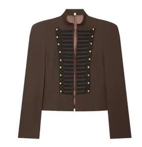 Close-up of brown military-style blazer featuring ornate black trim and gold buttons