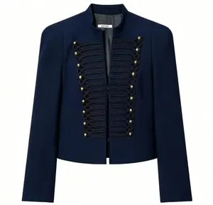 Detail view of navy military jacket featuring decorative rope braiding and gold buttons.