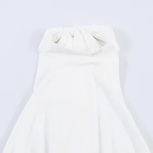 Macro view showing the elegant pleated halter neck detail of white summer dress