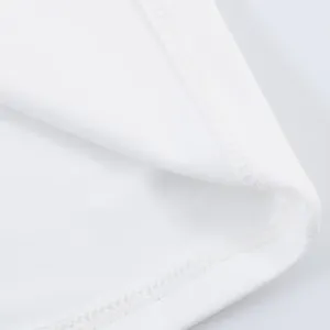 Detail showing high-quality stitching and soft white fabric of fashionable halter dress.