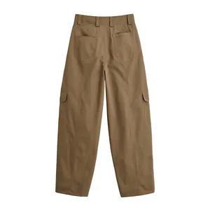 Detail back view of brown wide-leg cargo pants featuring functional utility pockets