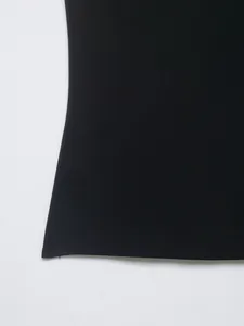 Detailed close-up showing the smooth texture of a black nylon blend women's casual top