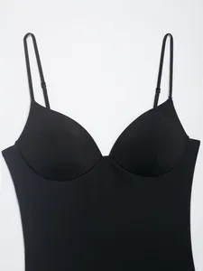 Close-up of black nylon blend top featuring molded cups and adjustable straps