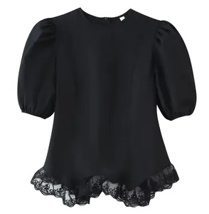 Detailed close-up view of a stylish black puff sleeve blouse featuring a delicate lace ruffled hem