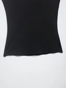 Close-up macro view of a black nylon blend fabric garment showing hemline stitching detail