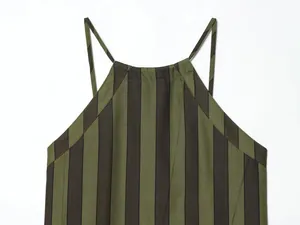 Close-up detail of a striped halter neck top featuring green and dark brown vertical lines