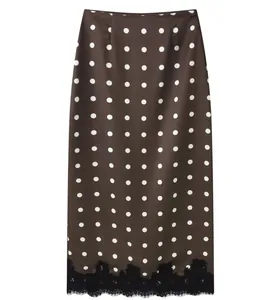 Elegant brown midi skirt featuring white polka dots and a delicate black lace trim detail