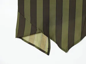 Close-up macro view showing the vertical striped pattern and irregular hem of this garment