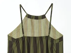 Detail shot showing the adjustable spaghetti straps and striped fabric of a women's top.