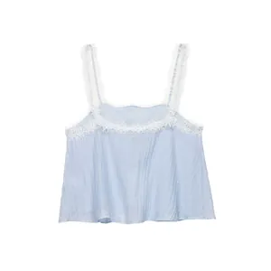 Detailed view of light blue lace crop top with white eyelash trim and delicate straps