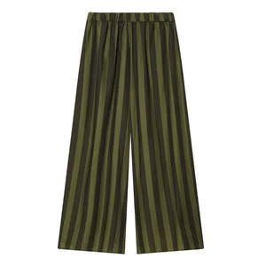 Close-up view of olive green and black striped wide-leg trousers for women with elastic waist.