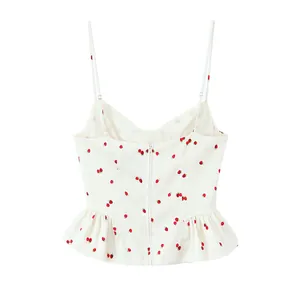 Back view of a white spaghetti strap top with red strawberry print and peplum ruffle.