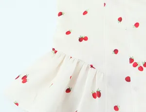 Detail view of sweet strawberry print fabric with elegant ruffled satin texture finish