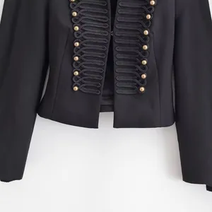 Elegant black military style blazer featuring decorative gold buttons and padded shoulders