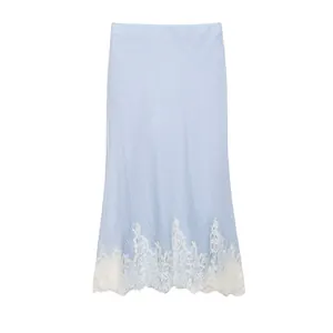 Elegant light blue textured midi skirt featuring an exquisite white floral lace hem detail