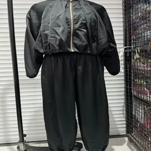 Black satin bubble sleeve bomber jacket and matching harem pants set for women.