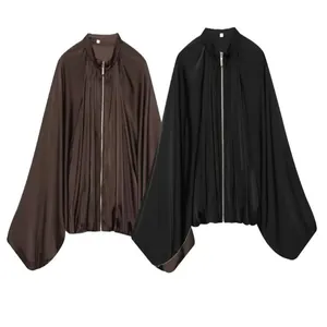 Detailed view of satin puff sleeve bomber jackets in black and coffee brown colors