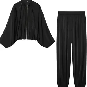 Elegant black satin two-piece set featuring a bubble sleeve bomber jacket and lantern pants