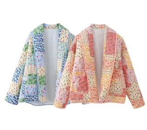 Detail view of floral quilted jackets with lapel featuring blue and pink patterns