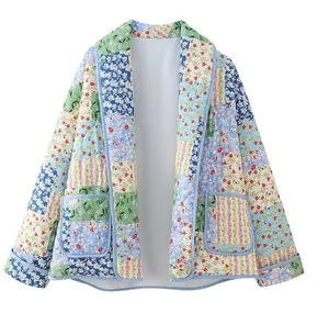 Detail shot of a women's lapel floral patchwork quilted jacket on white backdrop