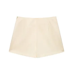 Detailed view of cream white high-waisted skort featuring an elegant side zipper design