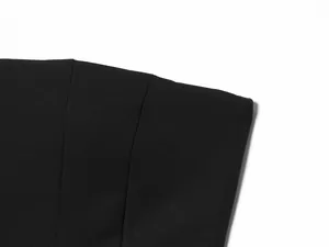 Close-up detail of black strapless tube top showing fine stitching and fabric texture