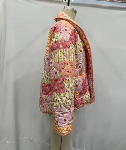 Side view showing details of floral patchwork quilted jacket with lapel and pocket