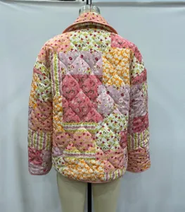 Detailed back view of a colorful floral patchwork quilted jacket with a lapel collar
