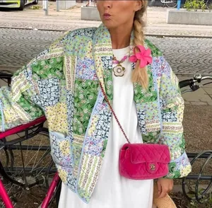 Detailed view of women's vintage floral quilted patchwork jacket in street style