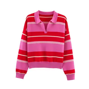 Detailed view of pink and red striped polo collar knit sweater with ribbed cuffs and hem