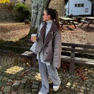 Stylish women's sherpa-lined faux suede jacket with large lapel in grey-brown color