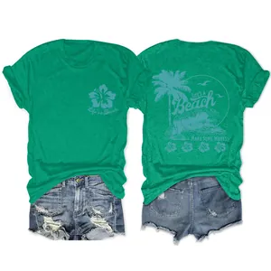 Détail du t-shirt vert pour femmes avec imprimé Life's a Beach vagues et palmier