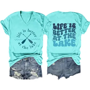 Close-up detail of women's blue V-neck T-shirt featuring 'Life is Better at the Lake' graphic