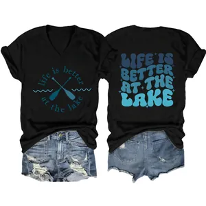 Detailed front and back view of black V-neck t-shirt with lake themed graphic print