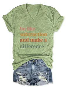 Close-up detail of casual green v-neck t-shirt with motivational graphic quote print