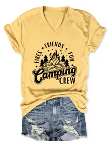 Detail of yellow V-neck T-shirt with Camping Crew graphic print and distressed denim shorts