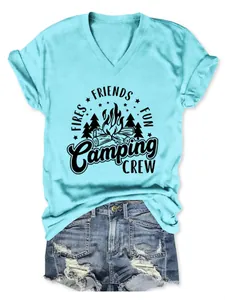 Detail showing 'Camping Crew' graphic on aqua V-neck tee with distressed denim shorts