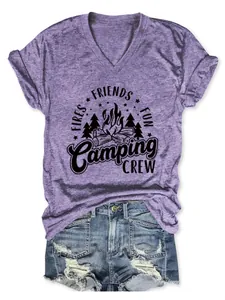 Close-up detail of a purple V-neck t-shirt featuring a Camping Crew graphic print.