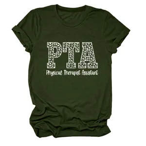 Detalle del estampado PTA Physical Therapist Assistant en una camiseta verde oliva.