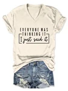 Détail d'un t-shirt beige à col en V avec le slogan 'Everyone was thinking it'.