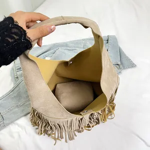 Vintage faux suede fringe shoulder tote bag with interior pouch and large capacity design
